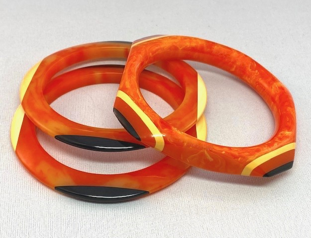 SZ20 Shultz 3 piece orange, black and cream bangle set